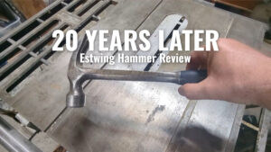 Estwing framing hammer after 20 years of use, held over a workbench – ITriedThat review